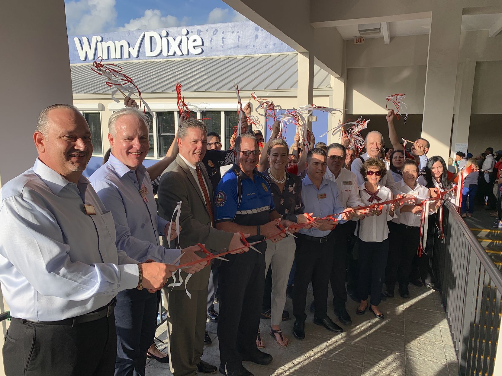 Local and corporate Winn Dixie management join local like Mayor Davey, KBPD Chief Press and Councilmember Katie Petros for the official ribbon cutting of the remodeled Key Biscayne store